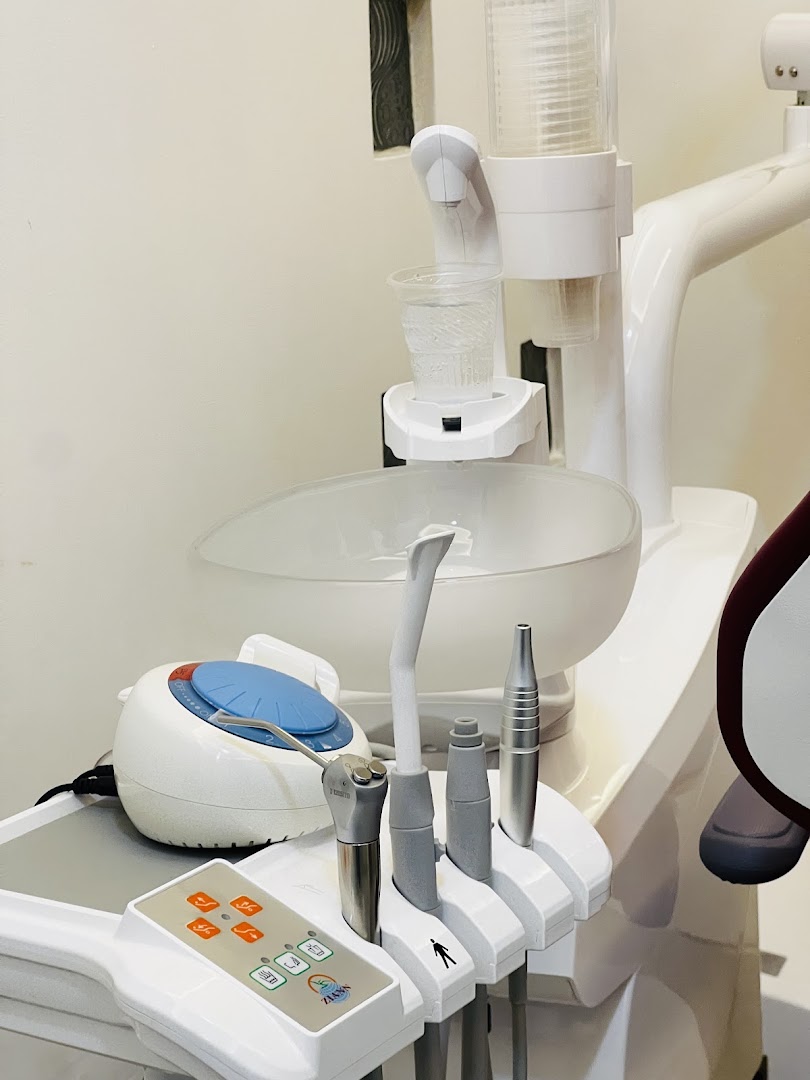 Close view of organized dental equipment beside a treatment chair